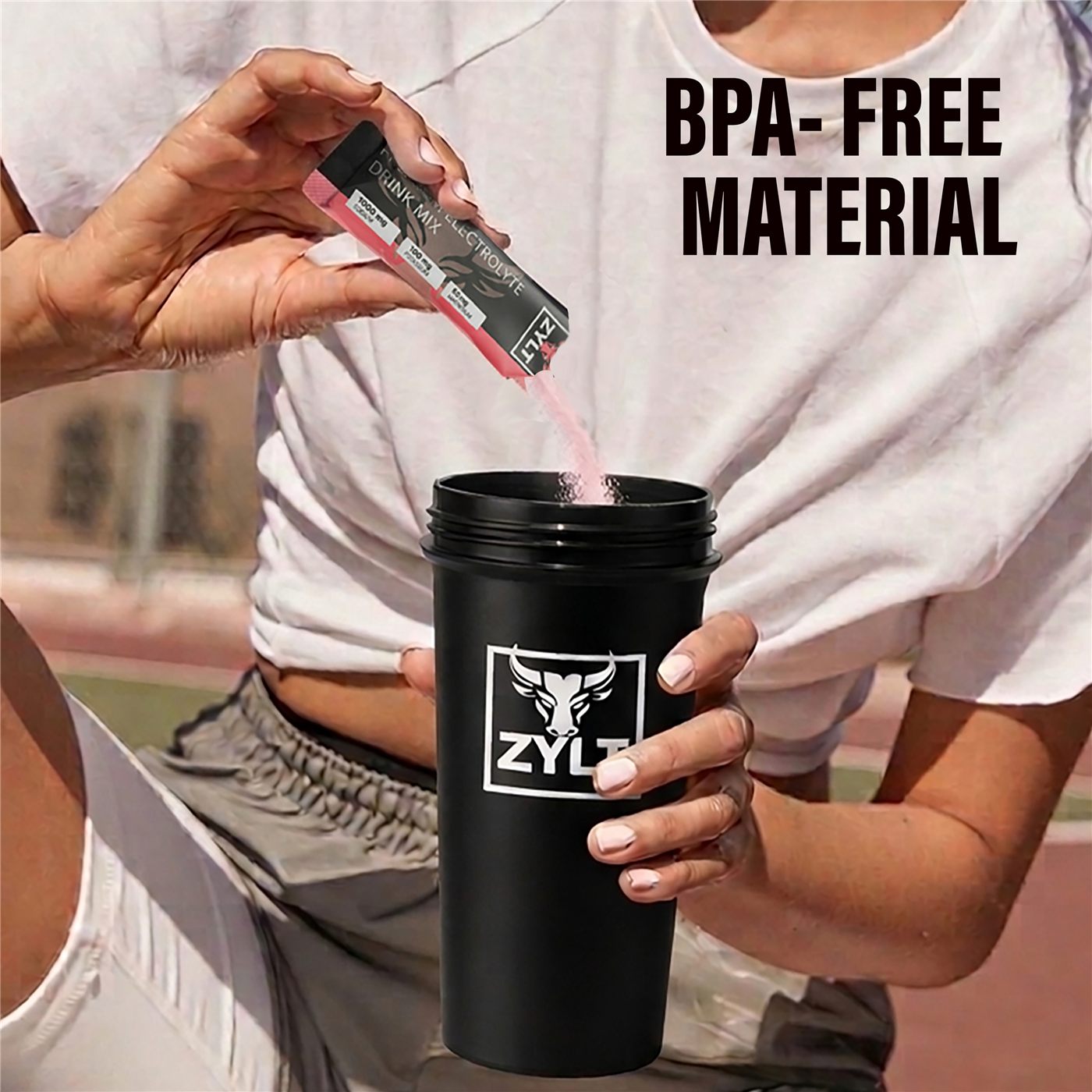 Pouring ZYLT electrolyte stick pack into BPA-free ZYLT shaker bottle